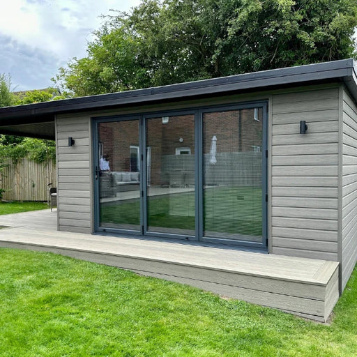 Composite Prime HD Clad Cedar Grey boards installed on a modern garden room exterior, creating a clean contemporary finish with durable weather-resistant composite cladding.