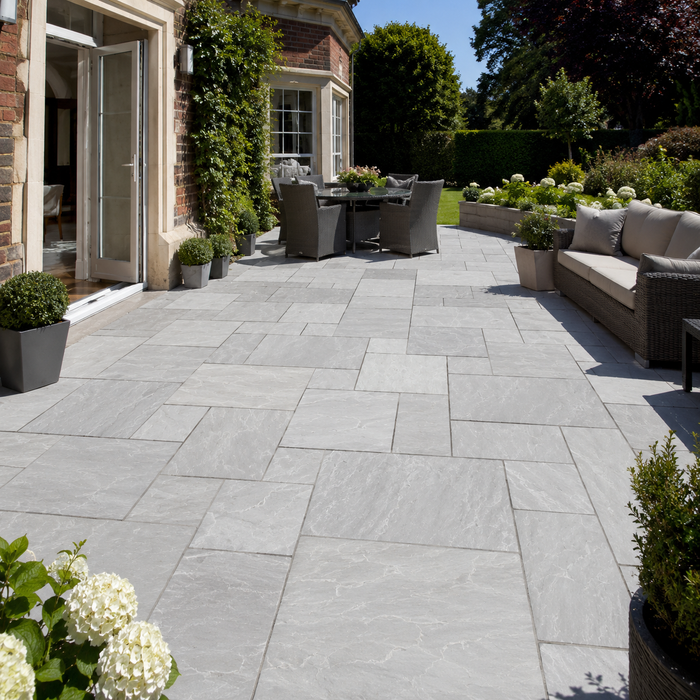 Complete Indian Sandstone Patio Pack Light Grey 19.5m2 installed in a large English garden patio