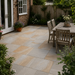Kandla Grey Indian sandstone paving installed in a traditional English rear garden with mixed grey and warm natural tones.