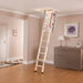 Keylite timber loft ladder installed in a modern home with an insulated ceiling hatch, red handrail and wooden steps.