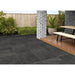 Lake Anthracite porcelain paving installed beside a contemporary garden dining area