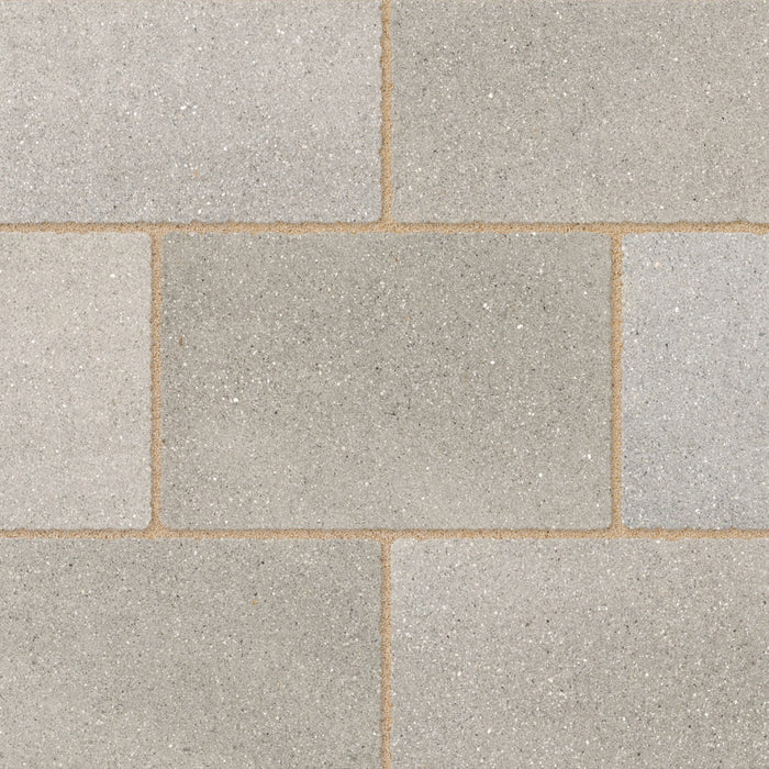 Close-up of Marshalls Carto Grey Multi concrete block paving showing the varied light and mid-grey tones.