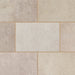 Close-up of Marshalls Carto Sand Multi concrete block paving showing the mixed warm beige and natural stone tones.