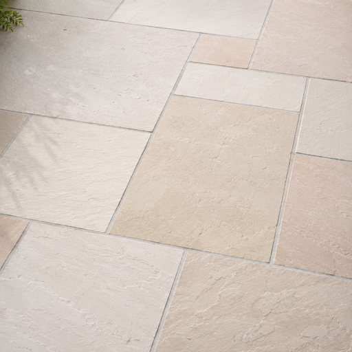 Close up of Mint Fossil Indian sandstone showing natural riven texture and pale fossil tones