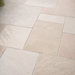 Close up of Mint Fossil Indian sandstone showing natural riven texture and pale fossil tones