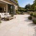 Mint Fossil Indian sandstone patio with outdoor sofa and light cream natural paving tones