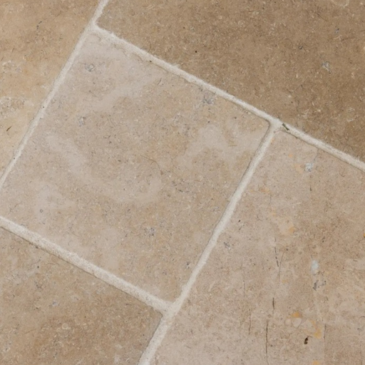 Paveworld Antique Sinai Pearl limestone close-up showing tumbled edges and fossil detail