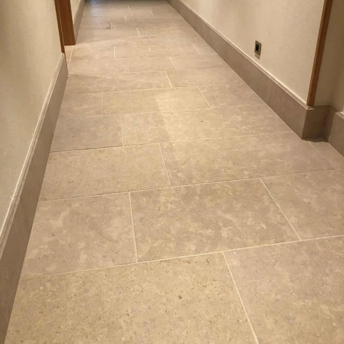 Paveworld Antique Sinai Pearl honed limestone floor showing warm beige natural tones