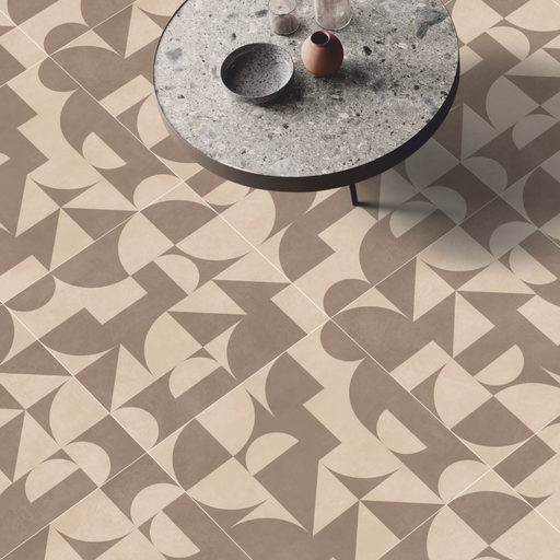 Beige geometric patterned porcelain paving installed beneath a contemporary round table.