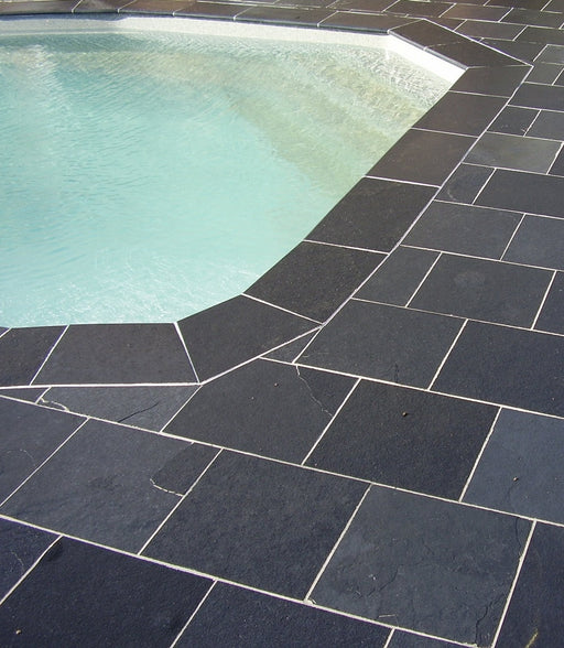 Paveworld Black Lime limestone paving around swimming pool