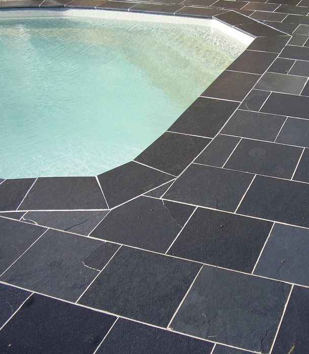 Paveworld Black Lime limestone paving around swimming pool