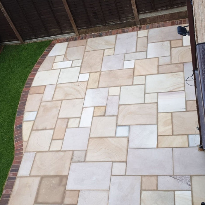 Paveworld Chivas Caramel Buff sandstone paving installed patio