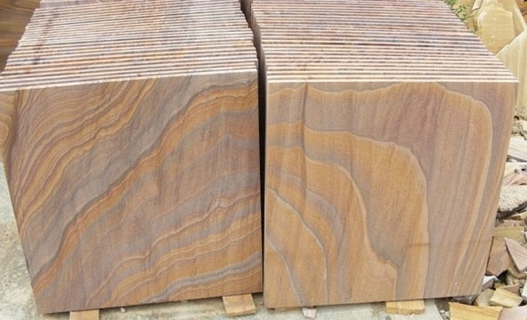 Paveworld Chivas Rainbow sandstone stacked slabs showing colour and sawn edges