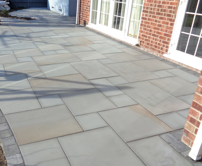 Paveworld Chivas Silver Dune smooth grey sandstone paving installed patio