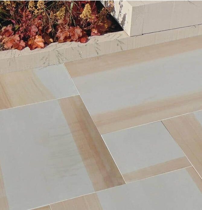 Paveworld Chivas York Swirl sandstone paving showing grey and rusty buff markings