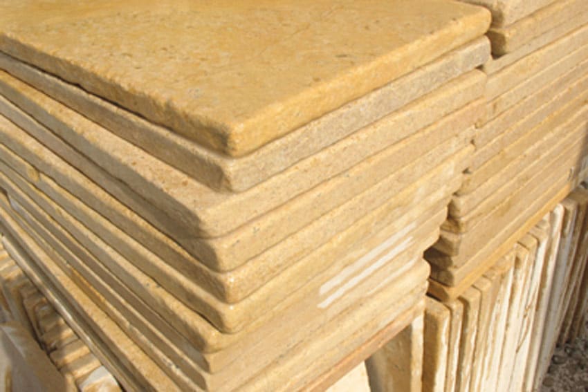 Paveworld Heritage Sunny Gold Antique Marble stacked slabs with tumbled edges