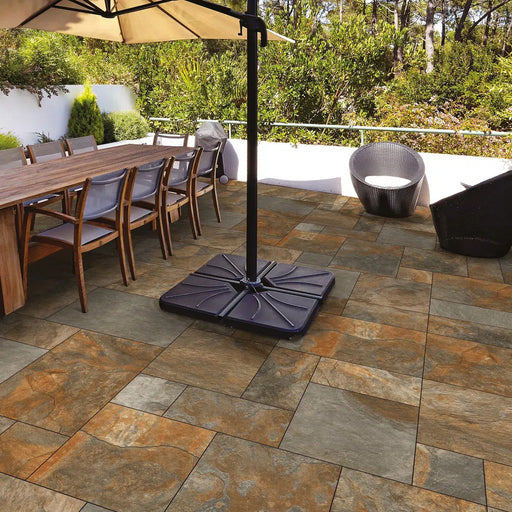 Paveworld Lake Rustic Copper manufacturer image showing installed porcelain paving patio