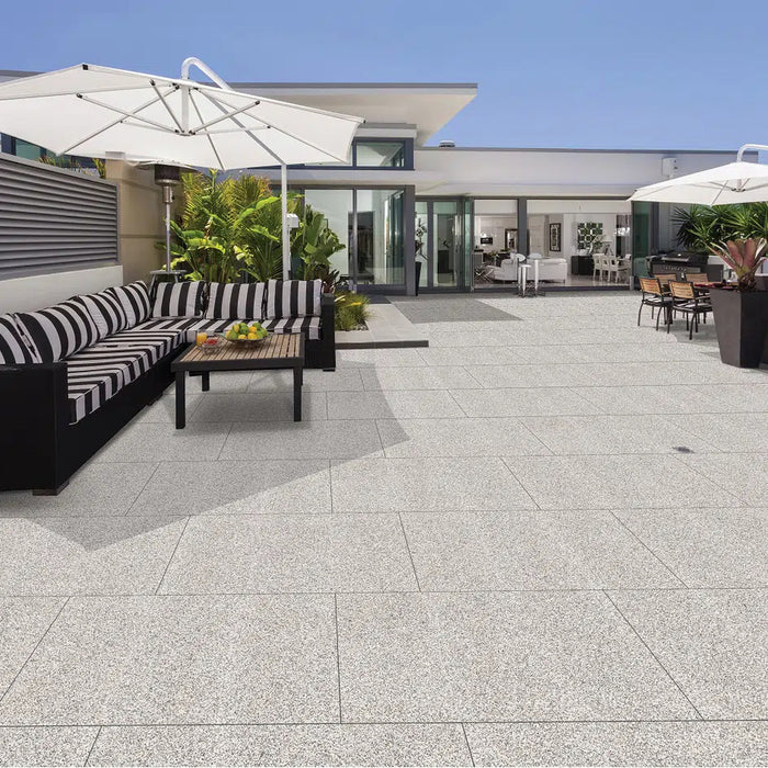 Paveworld Lake Silver Granite manufacturer image showing installed porcelain paving patio