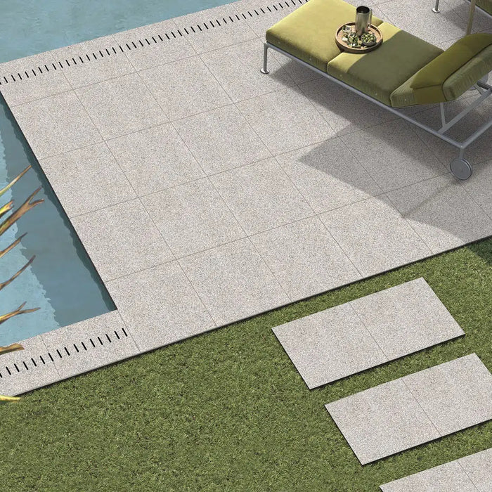 Paveworld Lake Silver Granite manufacturer image showing porcelain paving beside a pool