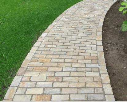 Paveworld Mint Fossil sandstone paving setts with natural fossil detail