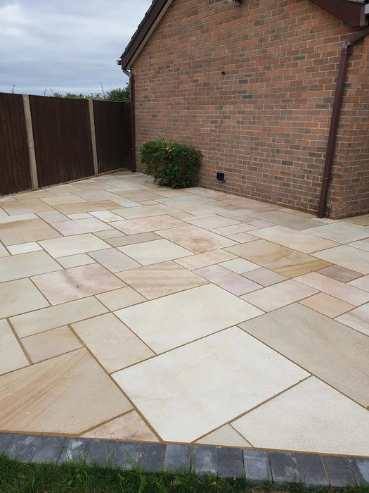 Paveworld Misty Caramel Buff sandstone paving installed patio