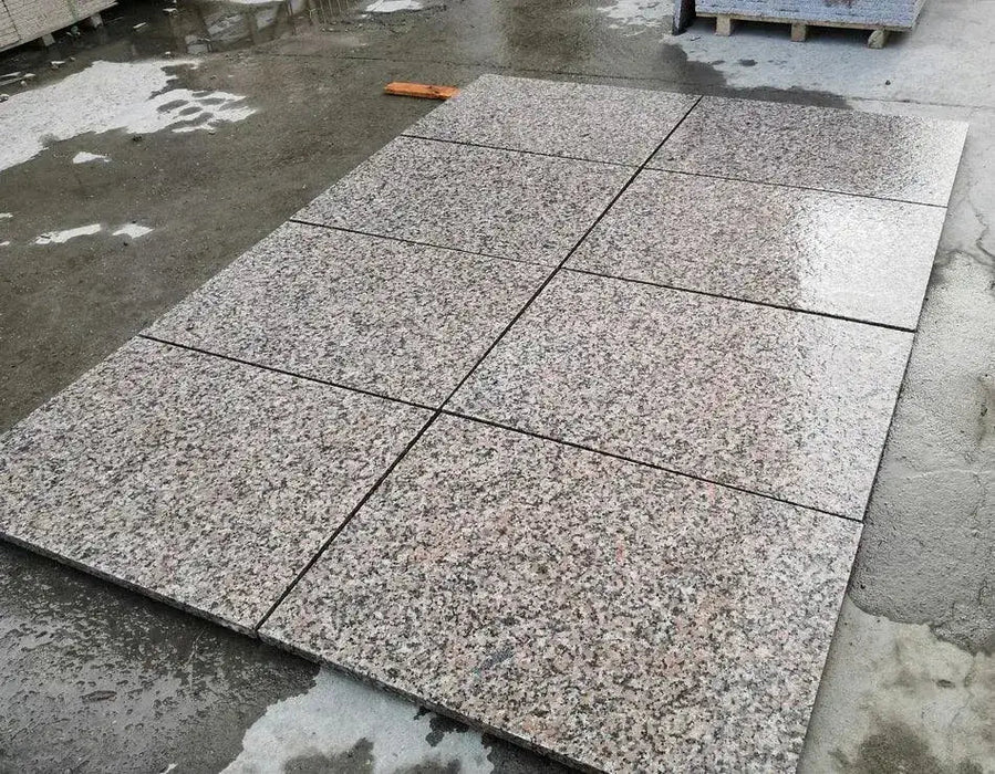 Misty Roza Pink flamed granite paving slabs showing pink speckled surface