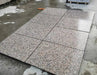 Misty Roza Pink flamed granite paving slabs showing pink speckled surface
