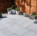 Paveworld Misty Silver Dune sandstone paving installed patio showing silver grey colour