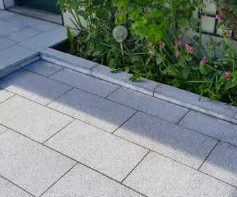Paveworld Misty Silver Grey granite paving installed garden patio