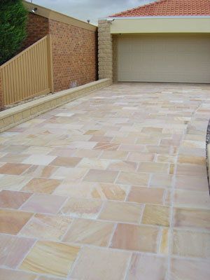 Paveworld Modak Rose sandstone paving showing pink and golden buff variation