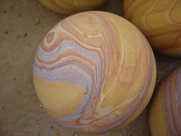 Paveworld Rainbow natural sandstone sphere showing pastel colour banding