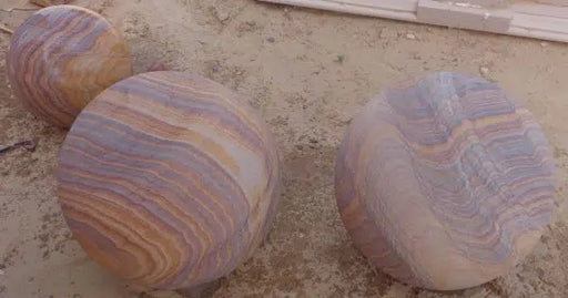 Paveworld Rainbow sandstone sphere range showing natural colour variation