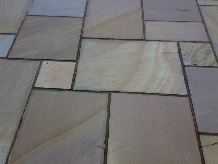 Paveworld Rippon Buff sandstone slabs showing riven surface and earthy tones
