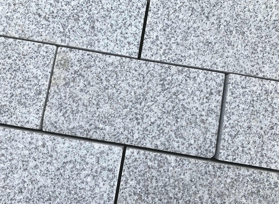 Paveworld Silver Grey flamed textured granite block setts